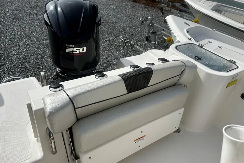 Slide: The Image of 2019 Wellcraft 222 Fisherman boat with Yamaha 250 engine, featuring cushioned seating. - 7