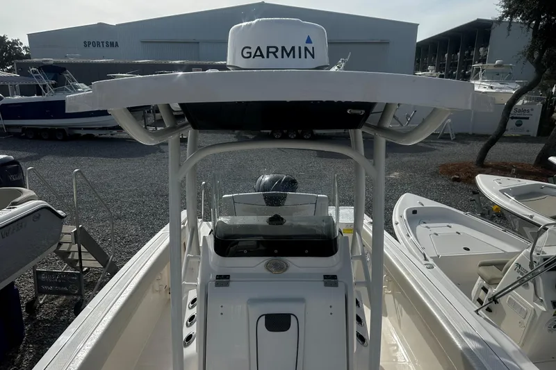 Slide: The Image of 2019 Wellcraft 222 Fisherman boat with Garmin equipment at a marina. - 9