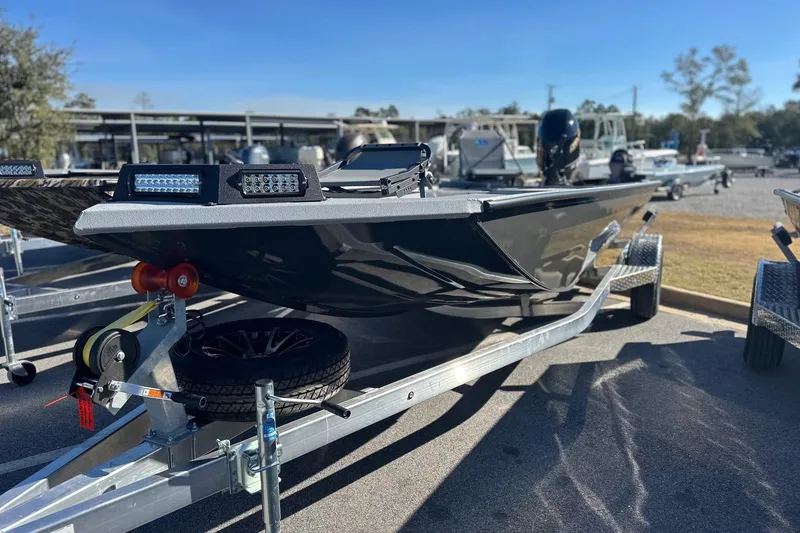 Slide: The Image of 2026 Avid 18 Commander boat on trailer, outdoor display. - 1