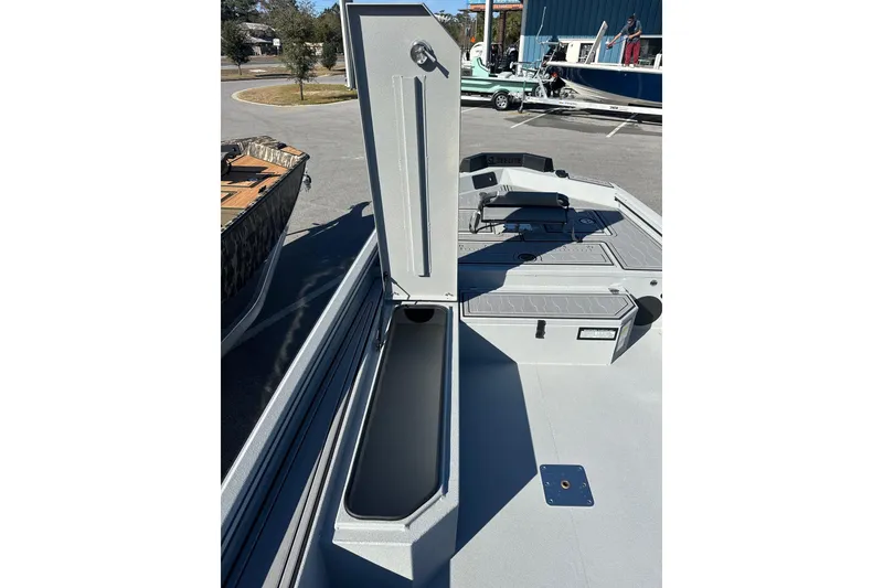Slide: The Image of 2026 Avid 18 Commander boat with open storage compartment on deck. - 14