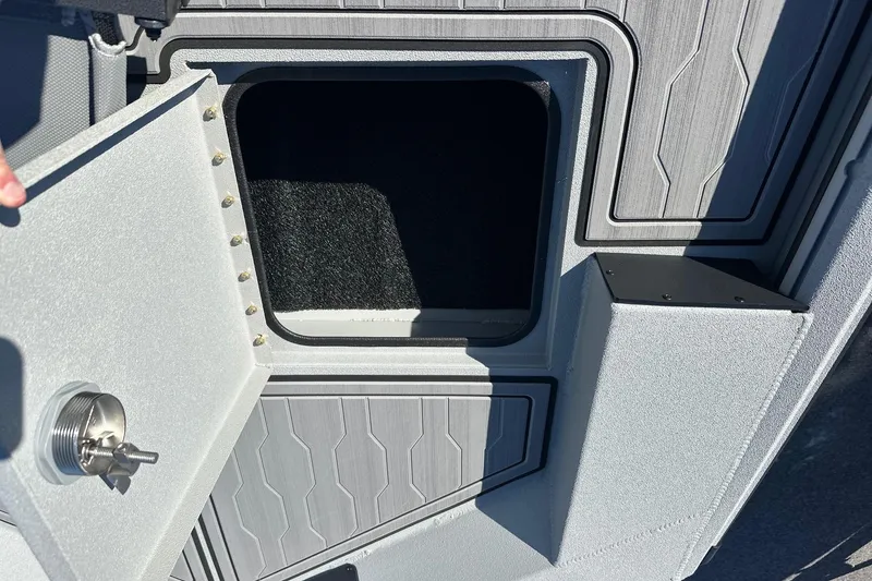 Slide: The Image of Open storage compartment in Avid 18 Commander boat, 2026 model. - 17