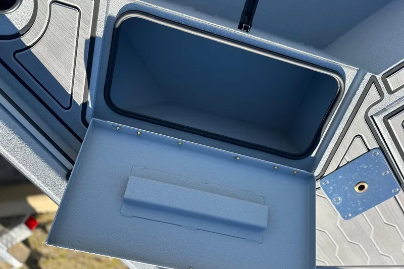 Slide: The Image of Open storage compartment in 2026 Avid 18 Commander boat, showcasing interior design. - 20