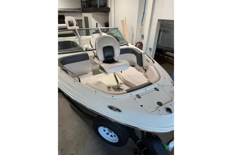 Slide: The Image of 2020 Chaparral 21 SSi Ski & Fish boat interior with seating and storage compartments. - 10