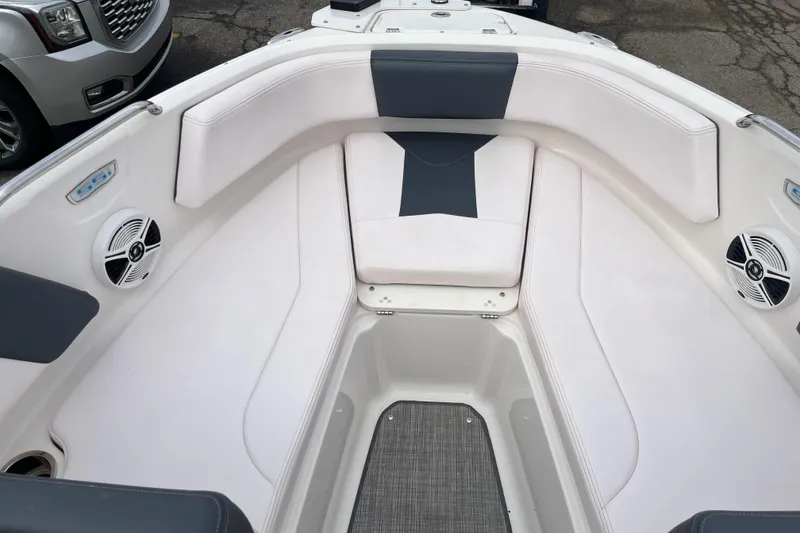 Slide: The Image of 2020 Chaparral 21 SSi Ski & Fish boat interior with white seating and speakers. - 12