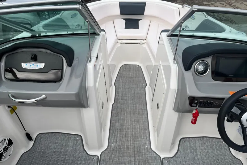 Slide: The Image of 2020 Chaparral 21 SSi Ski & Fish boat interior with modern dashboard and seating. - 15