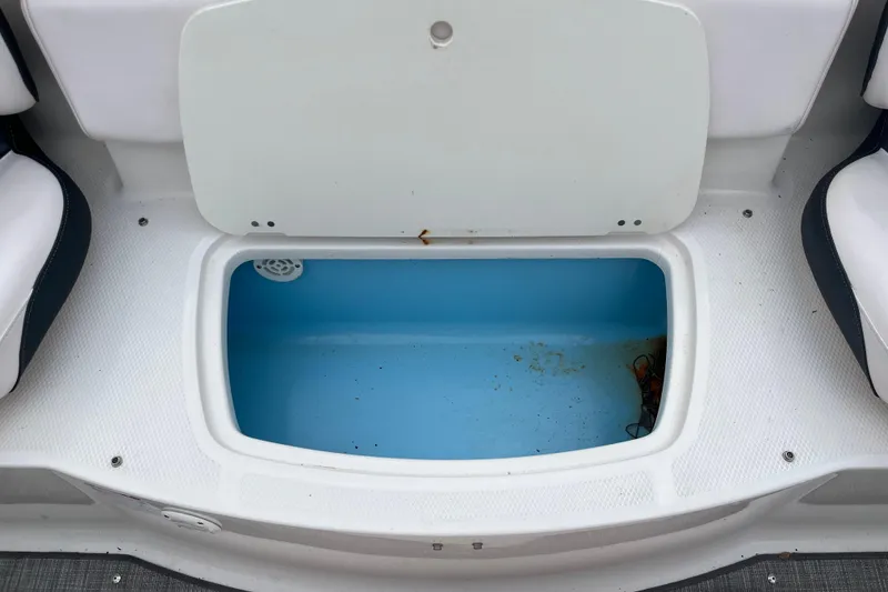Slide: The Image of 2020 Chaparral 21 SSi Ski & Fish boat storage compartment, open and empty. - 16