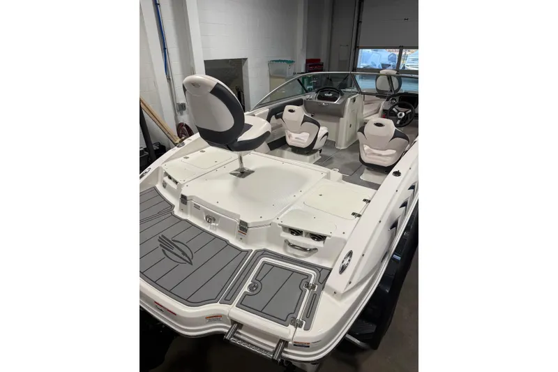 Slide: The Image of 2020 Chaparral 21 SSi Ski & Fish boat interior with seating and dashboard. - 22