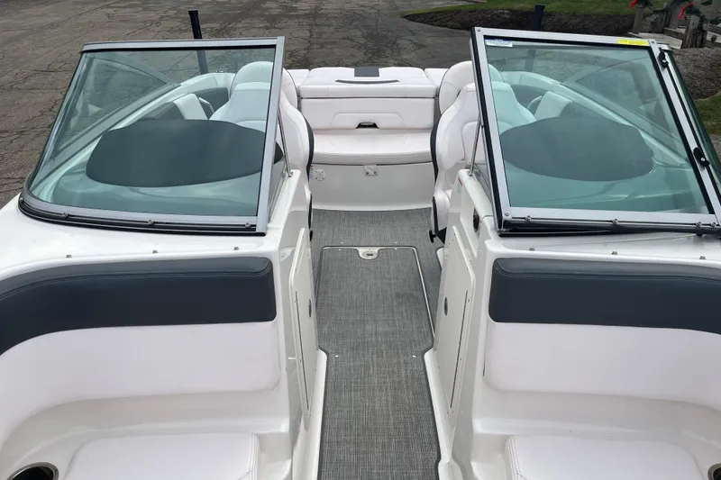 Slide: The Image of 2020 Chaparral 21 SSi Ski & Fish boat interior with dual windshields and seating. - 9