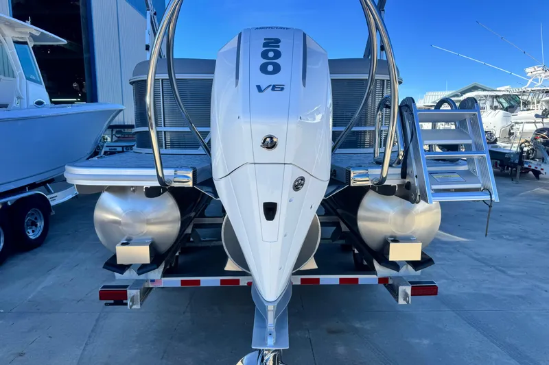 Slide: The Image of 2026 Bennington 23 SSR pontoon boat with powerful V6 engine, docked at marina. - 5