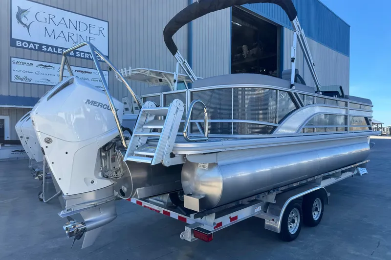 Slide: The Image of 2026 Bennington 23 SSR pontoon boat on trailer at Grander Marine dealership. - 6