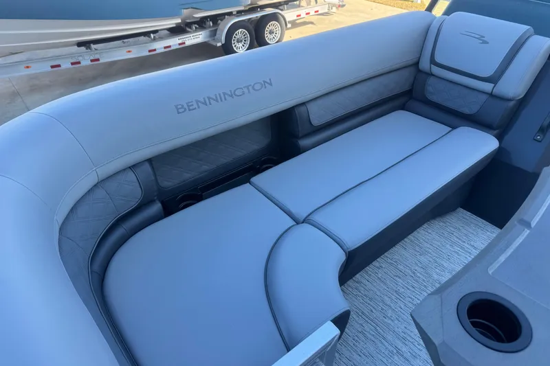 Slide: The Image of 2026 Bennington 23 SSR boat interior with luxurious gray seating and cup holder. - 9