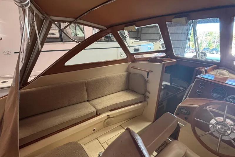 Slide: The Image of Interior of 2005 C.W. Hood Katama 30 boat with seating and steering wheel. - 12