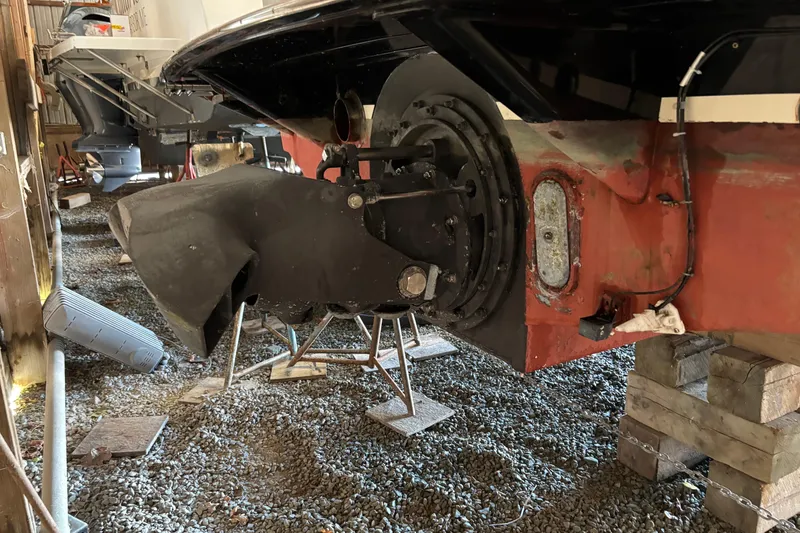 Slide: The Image of 2005 C.W. Hood Katama 30 boat in storage, showing propeller and hull details. - 24