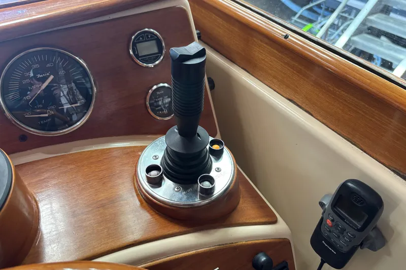 Slide: The Image of 2005 C.W. Hood Katama 30 boat dashboard with gauges and controls. - 6