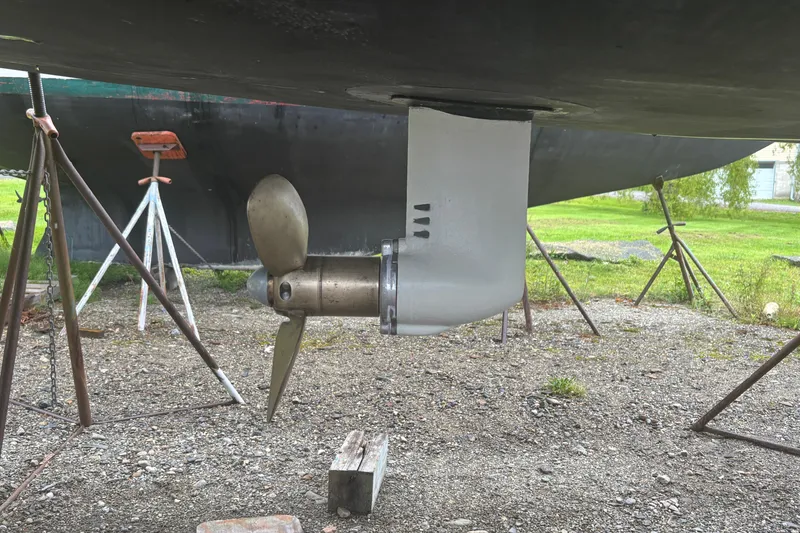 Slide: The Image of Propeller and rudder of 2017 Jeanneau Sun Odyssey 389 sailboat on dry dock. - 13