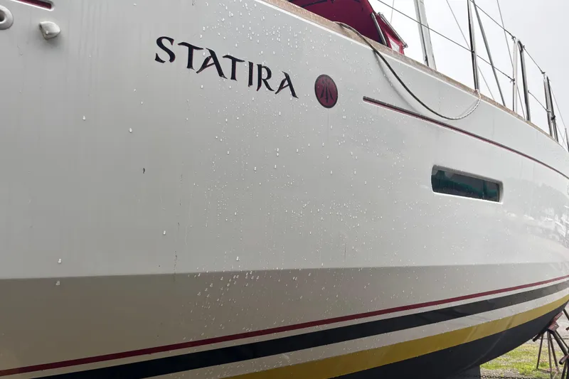 Slide: The Image of 2017 Jeanneau Sun Odyssey 389 sailboat named "Statira" with sleek white hull. - 17