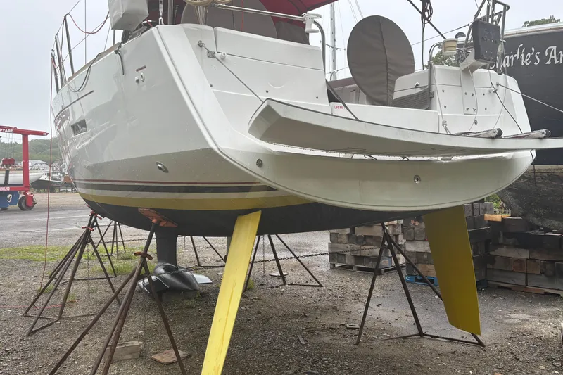 Slide: The Image of 2017 Jeanneau Sun Odyssey 389 sailboat on stands in a boatyard. - 18