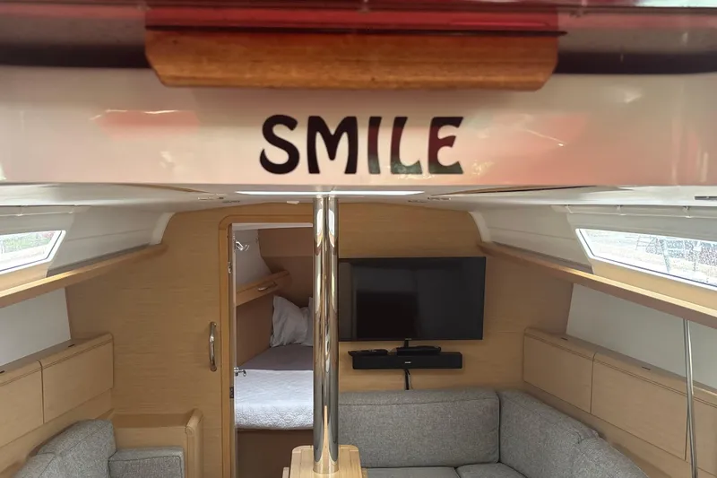 Slide: The Image of Interior of 2017 Jeanneau Sun Odyssey 389 sailboat with cozy seating and TV. - 35