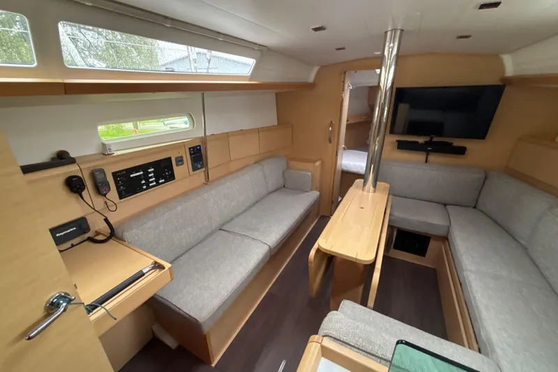 Slide: The Image of Interior of 2017 Jeanneau Sun Odyssey 389 sailboat with modern furnishings and navigation equipment. - 38