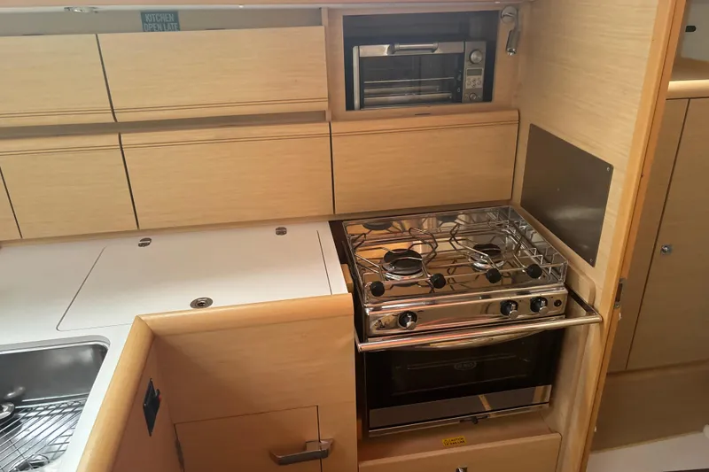 Slide: The Image of Modern kitchen in 2017 Jeanneau Sun Odyssey 389 yacht with stove and oven. - 41