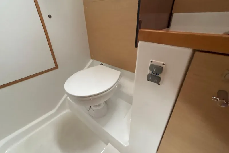 Slide: The Image of 2017 Jeanneau Sun Odyssey 389 yacht bathroom with modern toilet and compact design. - 53