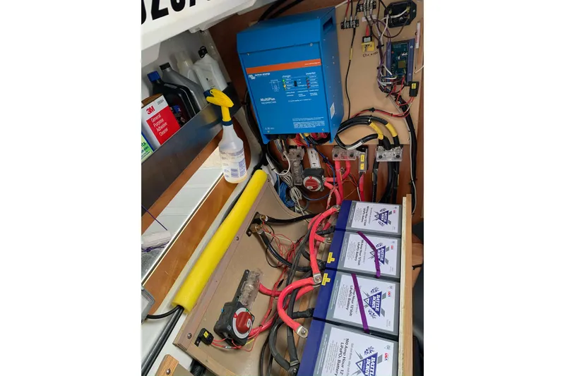 Slide: The Image of Electrical system of a 2017 Jeanneau Sun Odyssey 389 sailboat with batteries and wiring. - 60