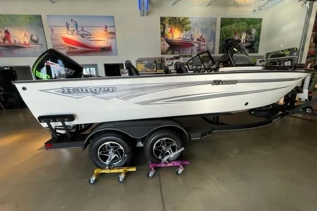 The Image of 2024 Ranger VX1988 WT boat on display in showroom with trailer. - 0