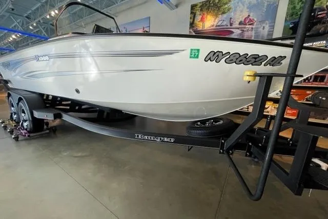 Slide: The Image of 2024 Ranger VX1988 WT boat on trailer in showroom, side view. - 1