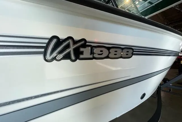 Slide: The Image of 2024 Ranger VX1988 WT boat with sleek white exterior and bold model lettering. - 110