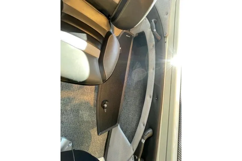 Slide: The Image of 2024 Ranger VX1988 WT interior storage compartment with sunlight reflection. - 115