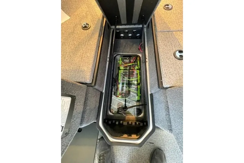 Slide: The Image of 2024 Ranger VX1988 WT boat battery compartment with Tracker lithium batteries. - 119