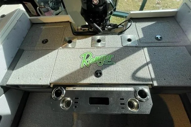Slide: The Image of 2024 Ranger VX1988 WT boat interior with control panel and storage compartments. - 125
