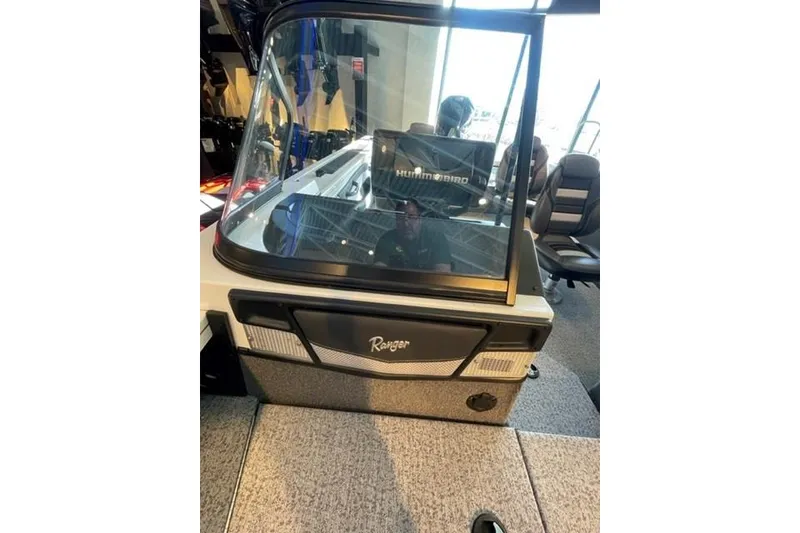 Slide: The Image of 2024 Ranger VX1988 WT boat interior with windshield and seating. - 19