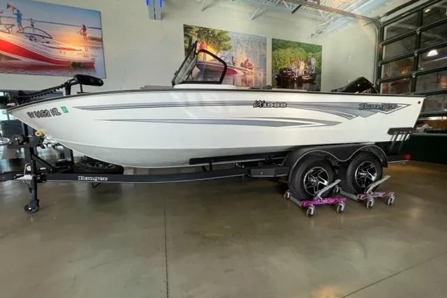 Slide: The Image of 2024 Ranger VX1988 WT boat on trailer in showroom setting. - 2
