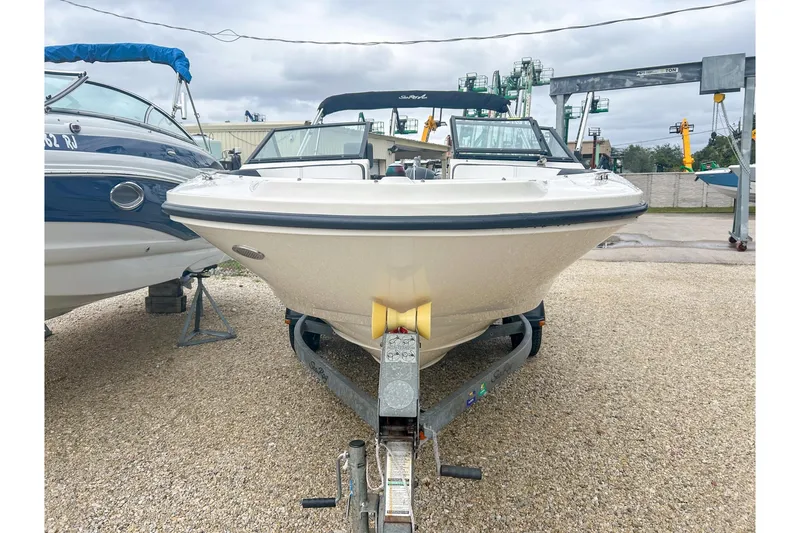 Slide: The Image of 2016 Searay 190 SPX boat on trailer, parked outdoors on gravel. - 3