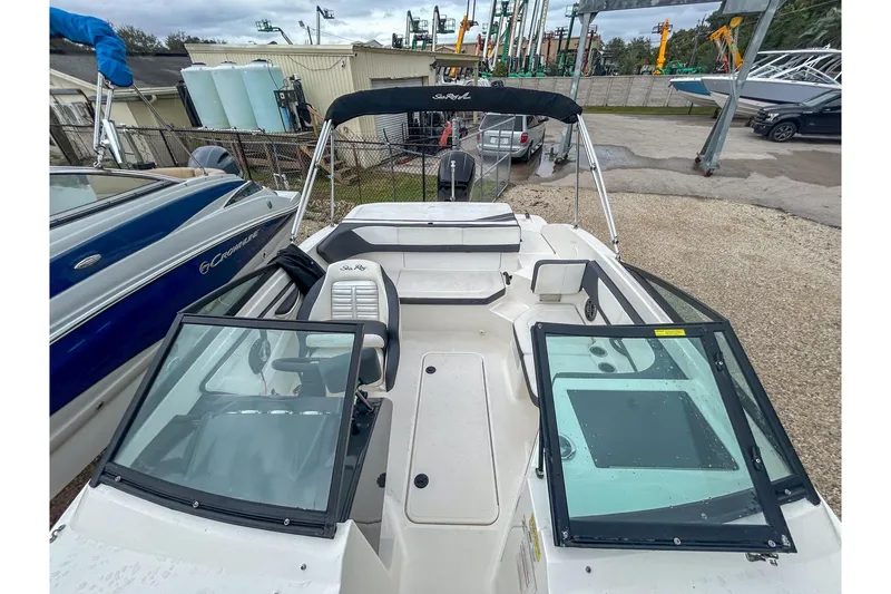 Slide: The Image of 2016 Searay 190 SPX boat with open cockpit and seating, displayed outdoors. - 8