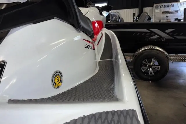 Slide: The Image of 2021 Kawasaki Jetski STX 160 in showroom, close-up side view. - 13