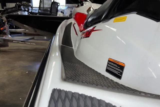 Slide: The Image of 2021 Kawasaki Jetski STX 160 in a showroom, showcasing sleek design and details. - 14