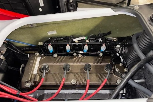 Slide: The Image of 2021 Kawasaki Jetski STX 160 engine compartment with visible wiring and components. - 15