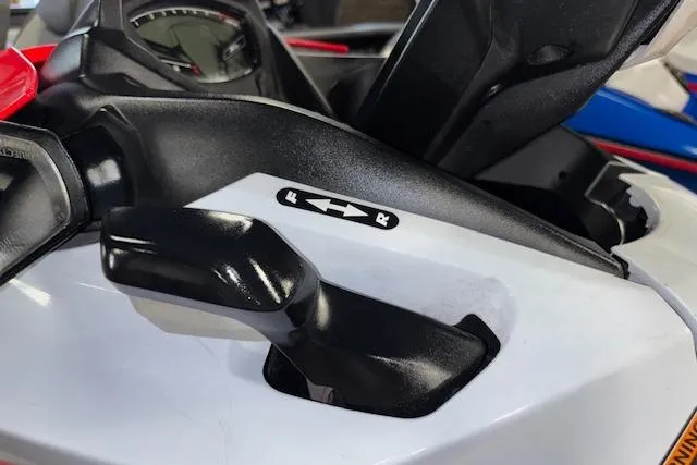 Slide: The Image of Close-up of 2021 Kawasaki Jetski STX 160 control lever with forward and reverse indicators. - 7