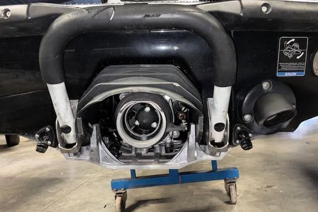 Slide: The Image of 2021 Kawasaki Jetski STX 160 rear view, showcasing engine and exhaust components. - 9