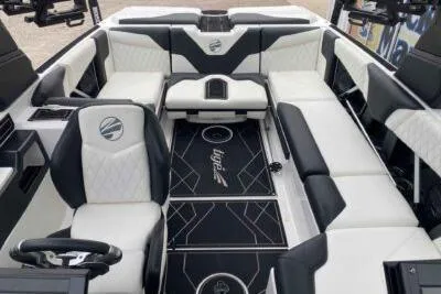 Slide: The Image of 2023 Tigé Z3 boat interior with luxurious seating and modern design. - 11