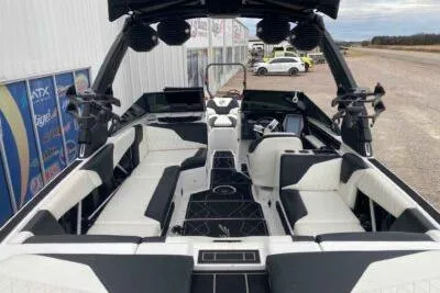 Slide: The Image of 2023 Tigé Z3 boat interior with sleek black and white seating design. - 6