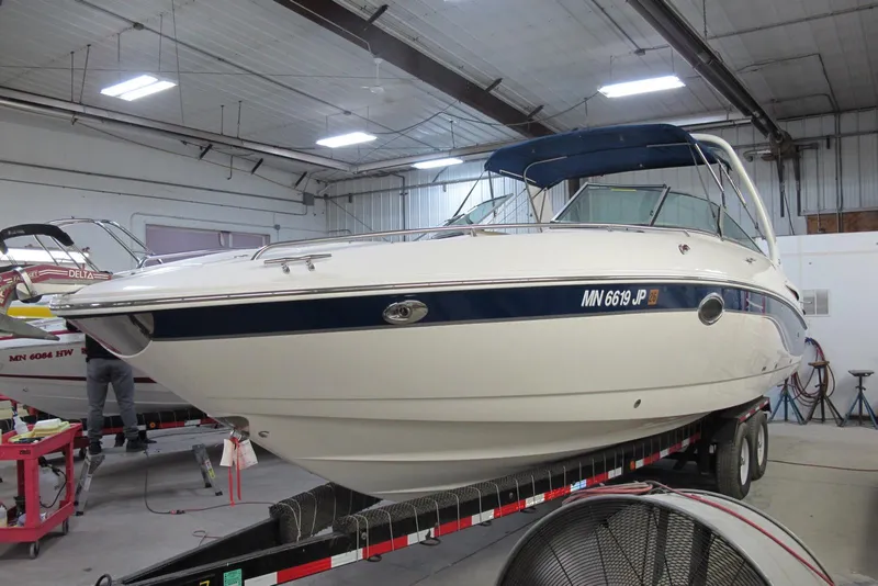 Slide: The Image of 2003 Chaparral 280 SSi boat on trailer in indoor storage facility. - 1