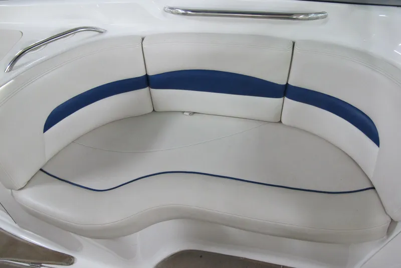 Slide: The Image of 2003 Chaparral 280 SSi boat seating with white and blue upholstery. - 10