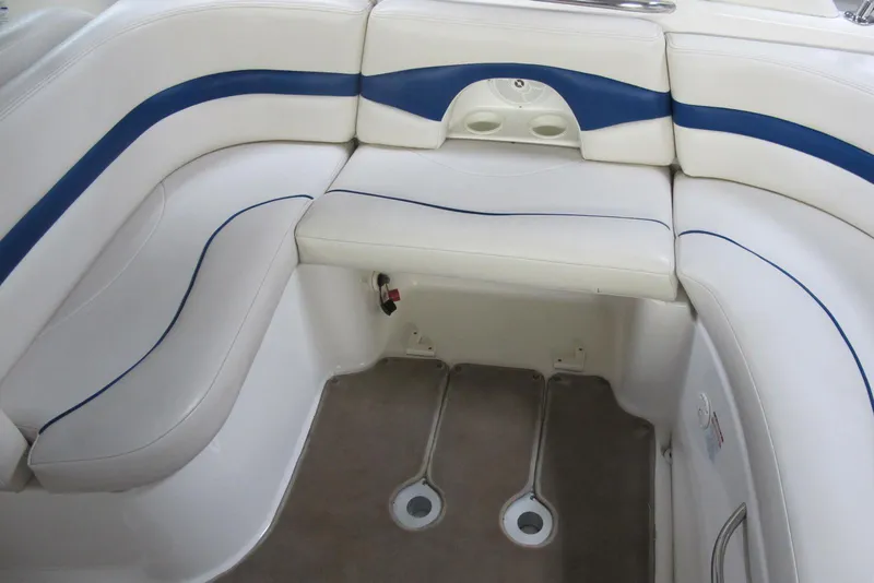 Slide: The Image of 2003 Chaparral 280 SSi boat interior with white and blue seating. - 11