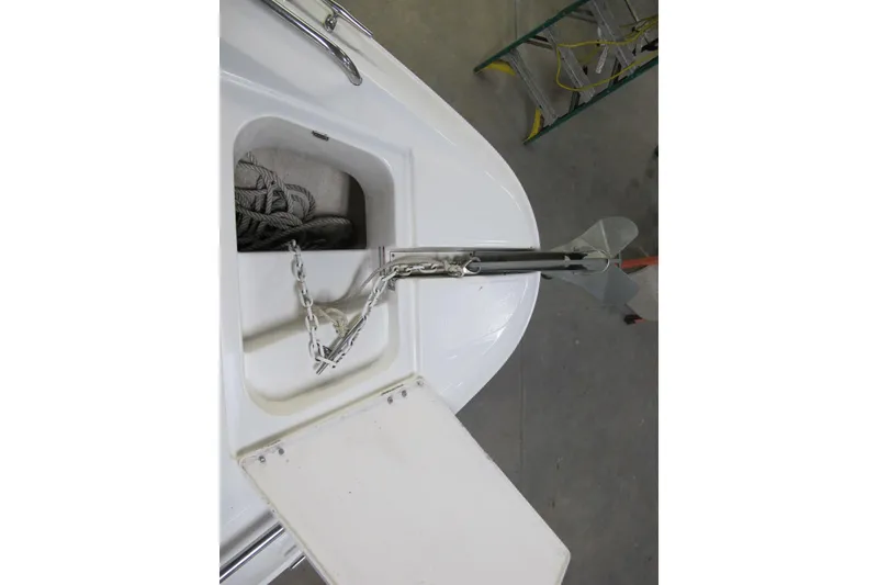 Slide: The Image of Anchor compartment of 2003 Chaparral 280 SSi boat with chain and rope. - 13