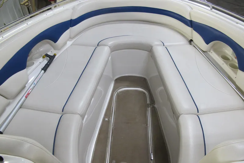 Slide: The Image of 2003 Chaparral 280 SSi boat interior with white and blue seating. - 5