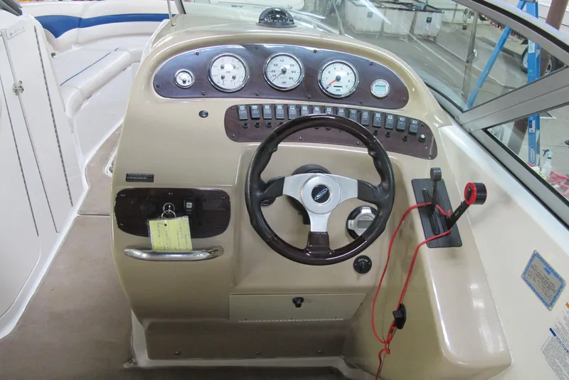 Slide: The Image of 2003 Chaparral 280 SSi boat dashboard with steering wheel and instrument panel. - 6