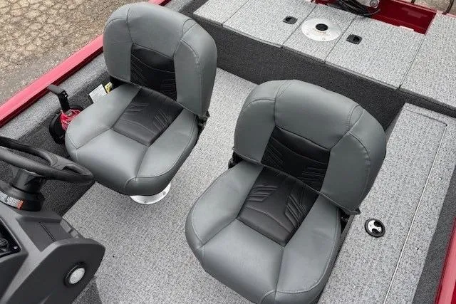 Slide: The Image of 2021 Tracker Super Guide V-16 SC boat interior with two gray seats. - 13
